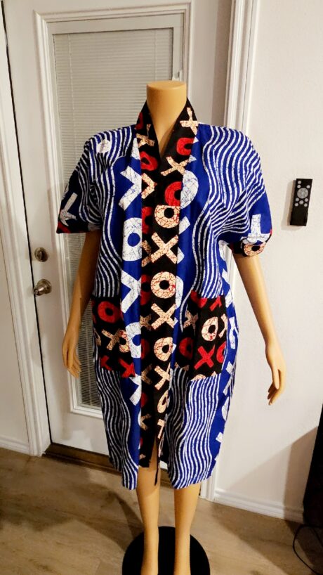 Model wearing the XOXO Kimono made from 100% Ankara fabric, featuring a flowing silhouette and luxurious African-inspired print.