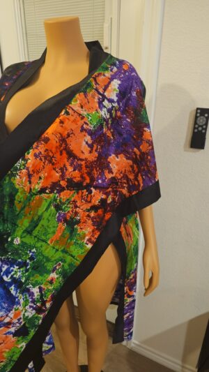 The Zuri Silk-Lined Kimono is a luxurious statement piece designed for elevated style and comfort. Crafted from premium Ankara fabric and finished with a smooth silk lining, the Zuri Silk-Lined Kimono drapes effortlessly while feeling soft and refined against the skin. Bold yet timeless, it blends African artistry with modern luxury—perfect for layering over casual looks or completing an elegant ensemble.