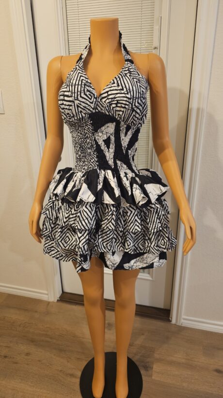 Model wearing the Adesuwa Regal Cup Gown, a smokey Ankara dress with a structured cup bodice and flowing regal silhouette.