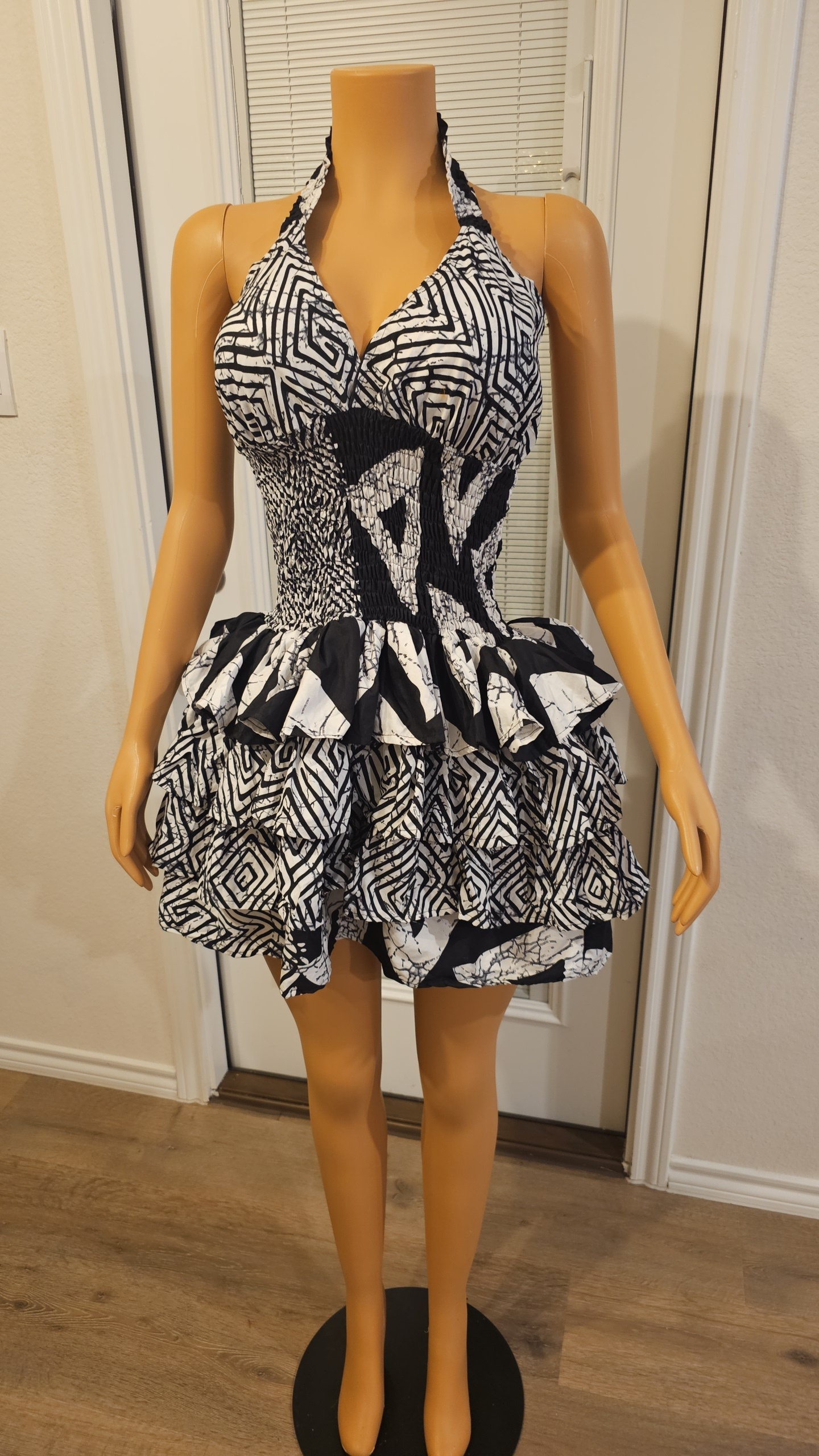 Model wearing the Adesuwa Regal Cup Gown, a smokey Ankara dress with a structured cup bodice and flowing regal silhouette.