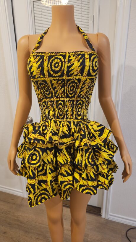 Zola Yellow smokey Ankara ruffle dress with a flowing silhouette and bold African-inspired print.